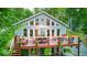 Charming home features a multi-level deck perfect for outdoor entertaining and relaxation with mature trees surrounding at 8205 Bass Dr, Nineveh, IN 46164