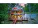 Multi-level home featuring wraparound decks, lush landscaping and lake views at 8205 Bass Dr, Nineveh, IN 46164