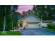 Charming home with an attached garage and well manicured lawn and beautiful landscaping at 8205 Bass Dr, Nineveh, IN 46164