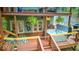 Outdoor deck features a hot tub and seating area perfect for relaxing after a long day surrounded by nature at 8205 Bass Dr, Nineveh, IN 46164