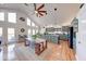 Inviting kitchen with island, hardwood floors, and a view into the spacious living area at 8205 Bass Dr, Nineveh, IN 46164