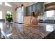 Close-up of kitchen island featuring gray granite countertops and decorative elements at 8205 Bass Dr, Nineveh, IN 46164