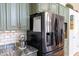 Kitchen with stainless steel refrigerator and modern appliances, providing a functional cooking space at 8205 Bass Dr, Nineveh, IN 46164