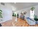 Bright living room featuring hardwood floors, a cozy armchair, and natural light from large windows at 8205 Bass Dr, Nineveh, IN 46164