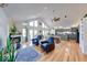 Bright, open living space with hardwood floors, fireplace, and views into the modern kitchen at 8205 Bass Dr, Nineveh, IN 46164
