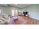 Bright living room featuring hardwood floors, neutral paint, and glass patio doors at 8205 Bass Dr, Nineveh, IN 46164