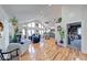 Expansive open-concept living area features hardwood floors, fireplace, and access to kitchen at 8205 Bass Dr, Nineveh, IN 46164