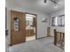 Hallway view into bathroom featuring wood cabinets, decorative mirror, and natural light at 8460 S Green Dr, Nineveh, IN 46164