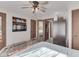 Comfortable bedroom features a ceiling fan, TV, and closet space for organized living at 8460 S Green Dr, Nineveh, IN 46164