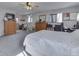 Large bedroom with neutral colors, carpet, and a variety of functional furniture at 8460 S Green Dr, Nineveh, IN 46164