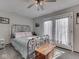 Bedroom with gray carpet, neutral walls, and a metal frame bed for a restful ambiance at 8460 S Green Dr, Nineveh, IN 46164