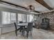 Dining area with natural light and a stone fireplace at 8460 S Green Dr, Nineveh, IN 46164