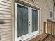 Double doors leading to a deck, offering seamless indoor-outdoor living and natural light at 8460 S Green Dr, Nineveh, IN 46164