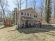 Inviting two-story home featuring blue shutters, covered porch, and lush natural surroundings at 8460 S Green Dr, Nineveh, IN 46164