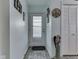 Bright hallway featuring modern flooring, white walls, and decorative accents at 8460 S Green Dr, Nineveh, IN 46164