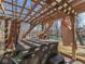 Backyard hot tub under a pergola, providing a private relaxation space with waterfront views at 8460 S Green Dr, Nineveh, IN 46164
