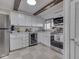 Kitchen features white cabinets, stainless steel appliances, and natural light at 8460 S Green Dr, Nineveh, IN 46164