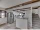 Kitchen with stainless steel refrigerator, white cabinets, and stairs at 8460 S Green Dr, Nineveh, IN 46164