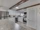 Kitchen features white cabinets, stainless steel appliances, and granite countertops at 8460 S Green Dr, Nineveh, IN 46164