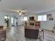 Living room with wood floors, fireplace, ceiling fan, and neutral walls at 8460 S Green Dr, Nineveh, IN 46164
