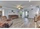 Cozy living room with light walls, a ceiling fan, and comfortable brown couches at 8460 S Green Dr, Nineveh, IN 46164