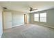 Bedroom featuring carpet, ceiling fan, neutral walls, and two windows at 8626 Jeff Cir, Brownsburg, IN 46112