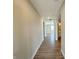 Bright hallway with hardwood flooring leading to various rooms in the house at 8626 Jeff Cir, Brownsburg, IN 46112