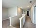 Upstairs hallway features carpet and a view down the hallway at 8626 Jeff Cir, Brownsburg, IN 46112