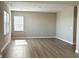 Spacious living room with natural light and hardwood floors, perfect for relaxation and entertaining at 8626 Jeff Cir, Brownsburg, IN 46112