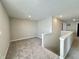 Upstairs loft area with carpet and a banister overlooking the stairwell at 8626 Jeff Cir, Brownsburg, IN 46112