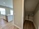 View of the pantry with wire shelving and kitchen details with a large island in the background at 8626 Jeff Cir, Brownsburg, IN 46112