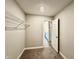 Bright walk-in closet with ample shelving, carpet, and white trim at 8626 Jeff Cir, Brownsburg, IN 46112