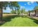 Lush backyard showing a shed and grassy lawn behind a chainlink fence at 8715 Legion Ln, Indianapolis, IN 46231