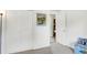 Bedroom featuring white walls, carpet flooring, and a view to an adjacent room at 8715 Legion Ln, Indianapolis, IN 46231