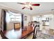 Dining room with hardwood floors, table, view to kitchen and bright window at 8715 Legion Ln, Indianapolis, IN 46231