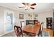 Cozy dining room with hardwood floors, fireplace, and traditional decor at 8715 Legion Ln, Indianapolis, IN 46231
