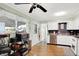 Well-lit kitchen with stainless steel appliances, white cabinets, and breakfast bar at 8715 Legion Ln, Indianapolis, IN 46231