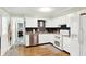 Bright kitchen features white cabinets, modern appliances, and new floors at 8715 Legion Ln, Indianapolis, IN 46231