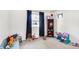 Playroom with a large window, carpet floors, and space for activities at 8715 Legion Ln, Indianapolis, IN 46231
