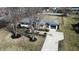 Charming single-story home features a well-maintained lawn, mature trees, and an attached garage at 8795 Carrollton Ave, Indianapolis, IN 46240
