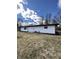 Rear of the house with a spacious lawn, ideal for outdoor activities at 8795 Carrollton Ave, Indianapolis, IN 46240