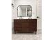 Bathroom showcasing double sink floating wood vanity and geometric tile floors at 8795 Carrollton Ave, Indianapolis, IN 46240