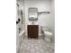 Bathroom features a modern vanity, hexagon tile floors and a separate shower and tub at 8795 Carrollton Ave, Indianapolis, IN 46240