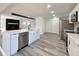 Bright open concept kitchen with stainless appliances and access to living area at 8795 Carrollton Ave, Indianapolis, IN 46240
