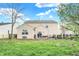 View of the home's backyard featuring a patio area, bench and grassy lawn at 9243 Crossing Dr, Fishers, IN 46037