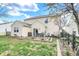The backyard has a patio set on a stone patio, a patch of grass and a garden at 9243 Crossing Dr, Fishers, IN 46037