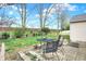 Enjoy the outdoors on this home's brick patio with an iron table and chairs at 9243 Crossing Dr, Fishers, IN 46037