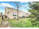 Picture shows the backyard of the home, including a grassy area and fencing at 9243 Crossing Dr, Fishers, IN 46037