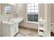 Bright bathroom with a large window and white vanity, providing a clean and fresh space at 9243 Crossing Dr, Fishers, IN 46037