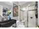 Modern bathroom featuring black vanity and shower with sliding glass doors at 9243 Crossing Dr, Fishers, IN 46037